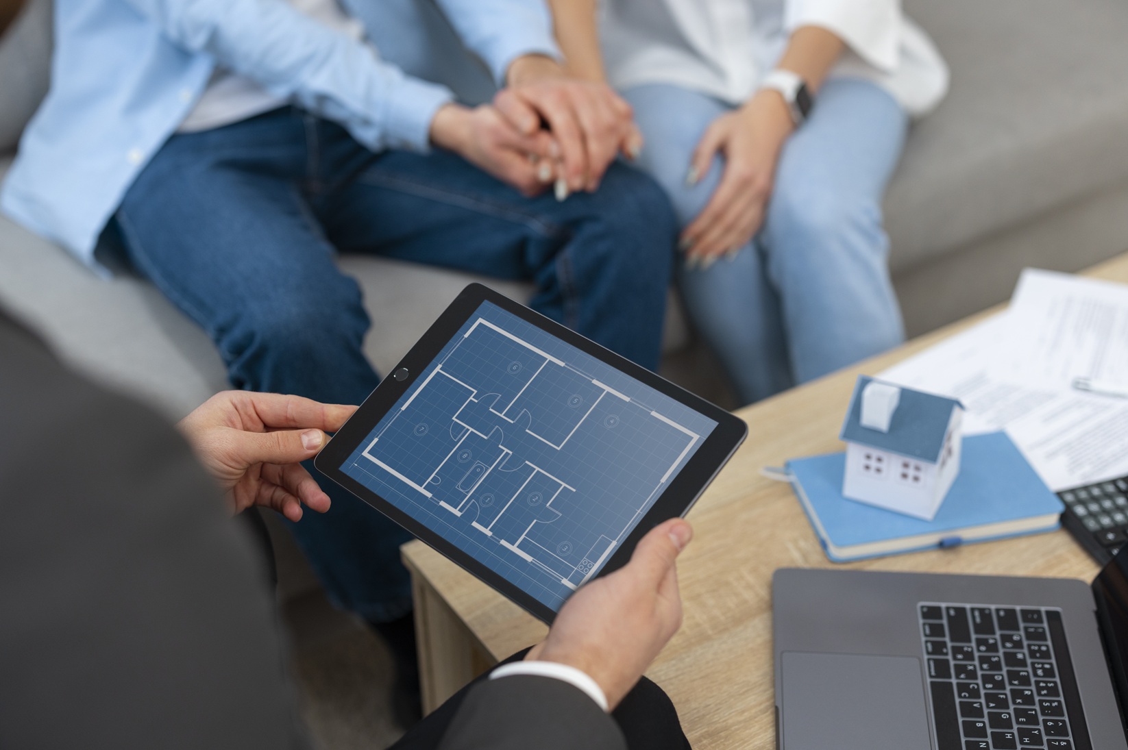 male-real-estate-agent-doing-business-showing-house-potential-buying-couple